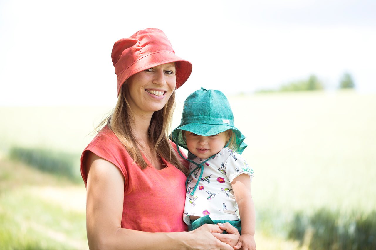 PurePure Mütze Nackenschutz Leinen - mango white - Familienbande